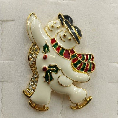 SFJ Gold Tone Enamel Ice Skating Dancing Snowman with Rhinestone Pair Brooch