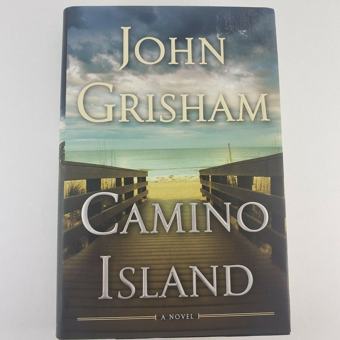 3 John Grisham Hardcover Novels with The Innocent Man ROGUE LAWYER Camino Island
