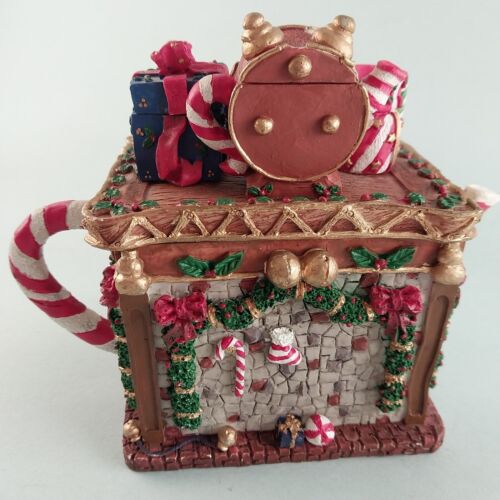 The Christmas Collectibles Fireplace Clock Wrapped Gifts Teapot By Seymour Mann