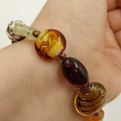 Avon Chic Multi Pattern Glass Beaded Leaf Elephant Charm Stretchable Bracelet