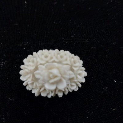 White Molded Celluloid Plastic Carved Style Brooch 1" Oval Flower Design