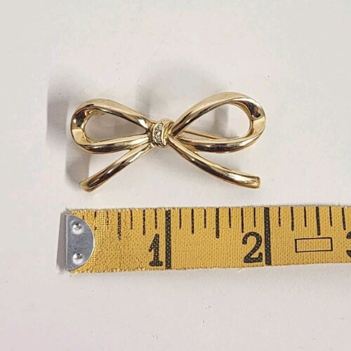 Gold Tone Bow Brooch with Clear Rhinestones 2" x 1.5"
