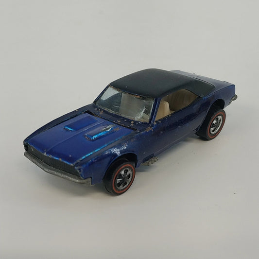 Vintage Hot Wheels Redline Custom Camaro in Spectraflame Blue with black roof and white interior