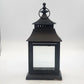 Black metal and clear glass candle lantern with pagoda-style roof