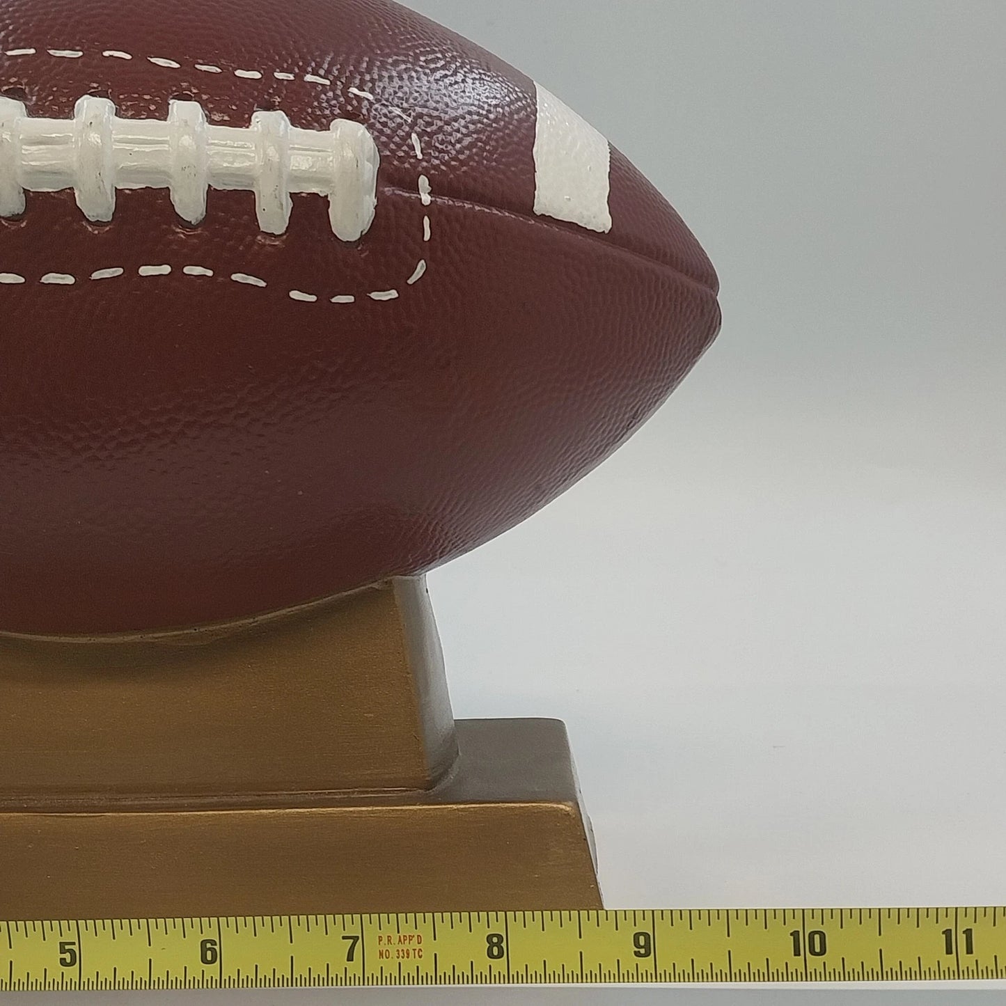 Ceramic Football Coin Bank Textured Sport Piggy Bank Brown on Pedestal Base 9.5"