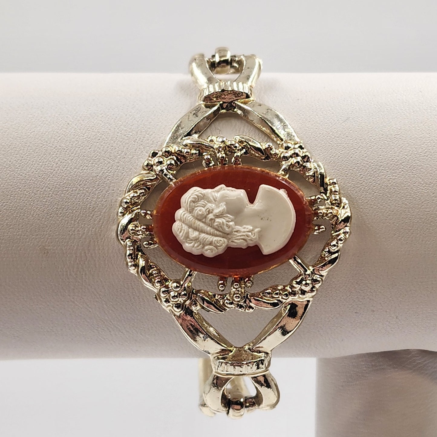 Gold Tone Hinged Bangle Bracelet with Red and White Lady Shell Cameo Charm 7"