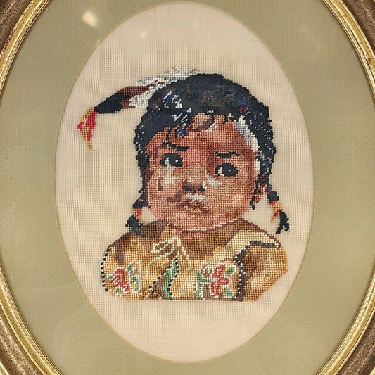 Vintage framed needlepoint portrait of Native American girl in oval wood frame