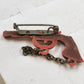 Title: Western Revolver Pistol Brooch Pin Red Miniature Gun Chain Novelty Vtg