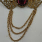 Gold Tone Filagree Metal Work & Cabochon Stone with Dangling Multi Chains Brooch