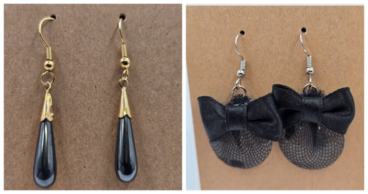 Two pairs of vintage black dangle earrings with gold and silver tone designs