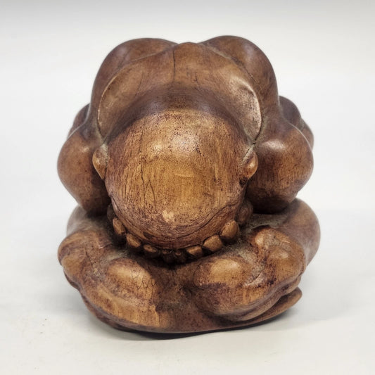 Hand-carved wooden Weeping Buddha Orang Malu figurine in brown wood