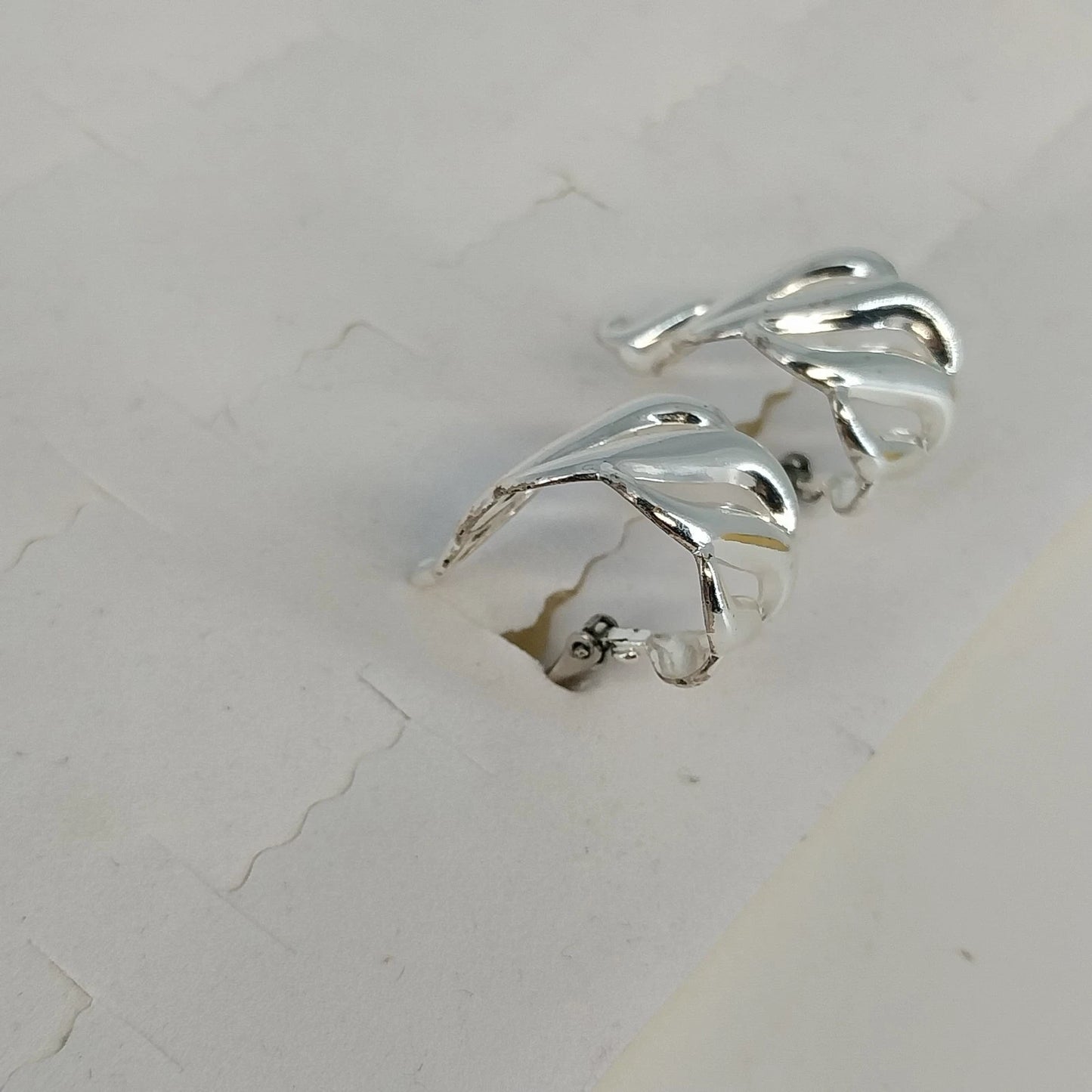 Napier Silver Tone Clip On Screw Back Earrings Swirl Half Hoop Polished Vintage