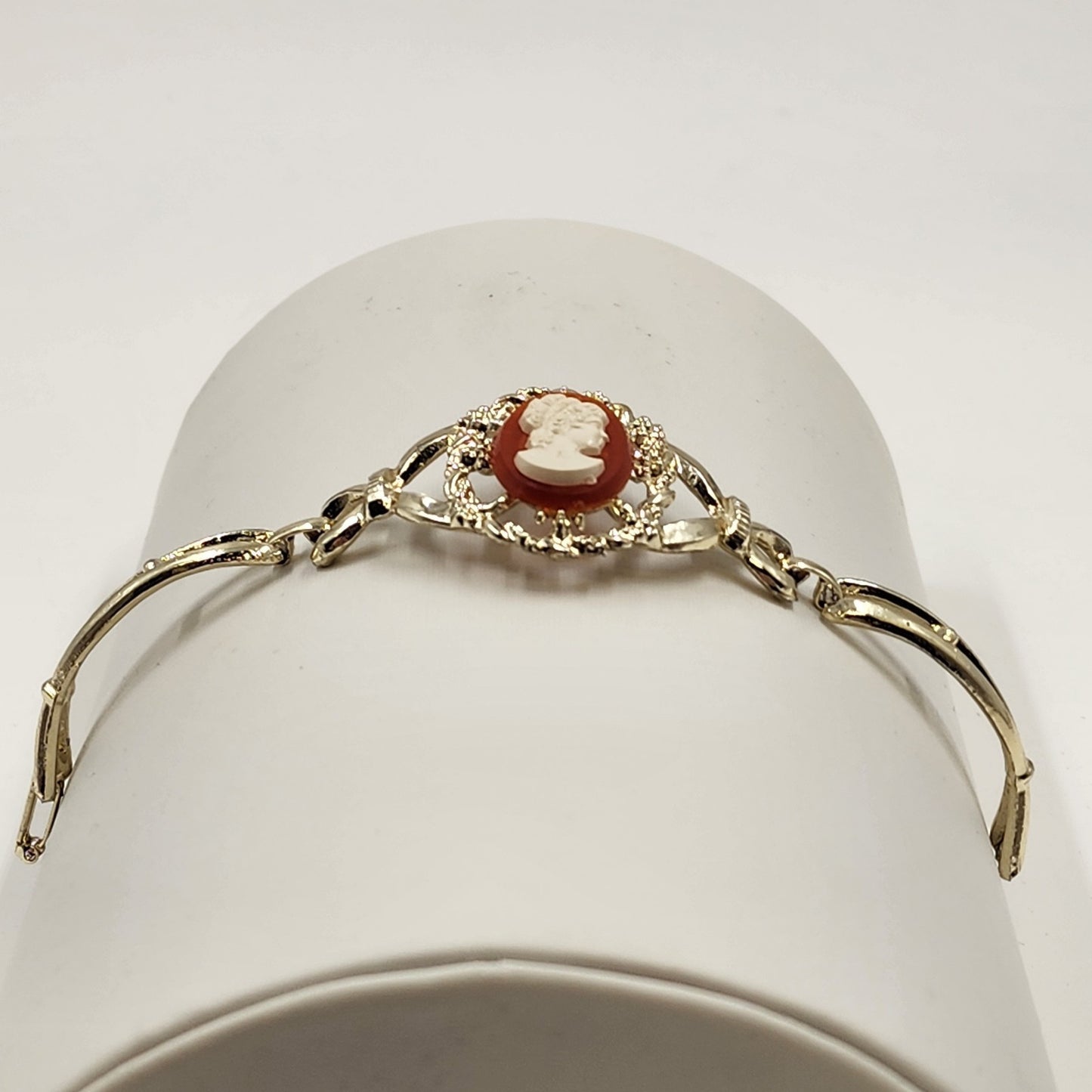 Gold Tone Hinged Bangle Bracelet with Red and White Lady Shell Cameo Charm 7"