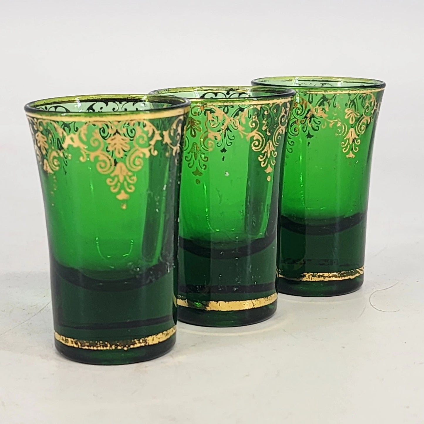 Set of 3 emerald green Italian shot glasses with gold trim vintage