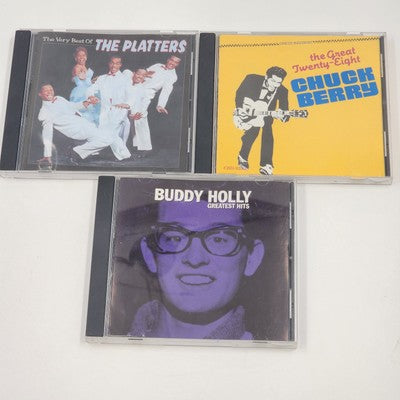 Three classic rock and DooWop CDs featuring Buddy Holly, Chuck Berry and The Platters
