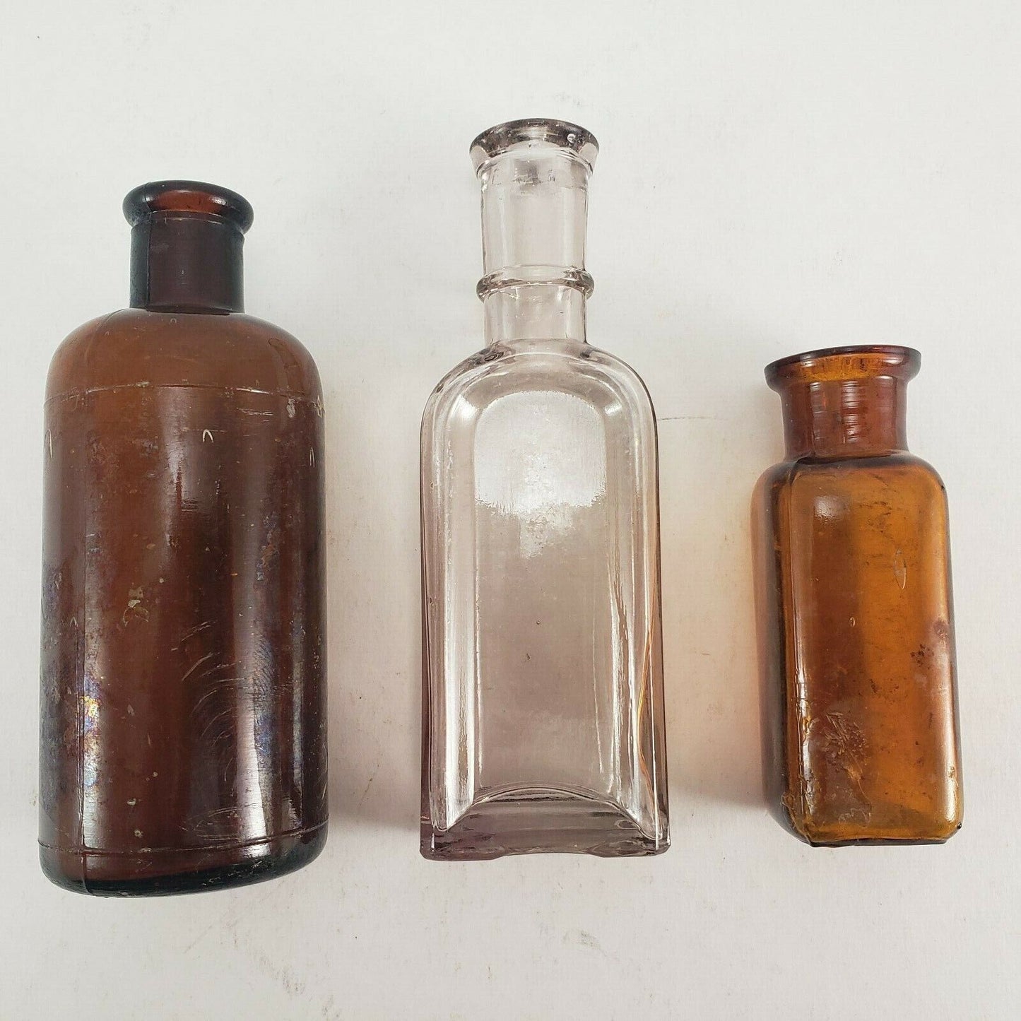 3 Small Antique Medicine Bottles 2 Brown 1 Clear Differing Shapes and Sizes