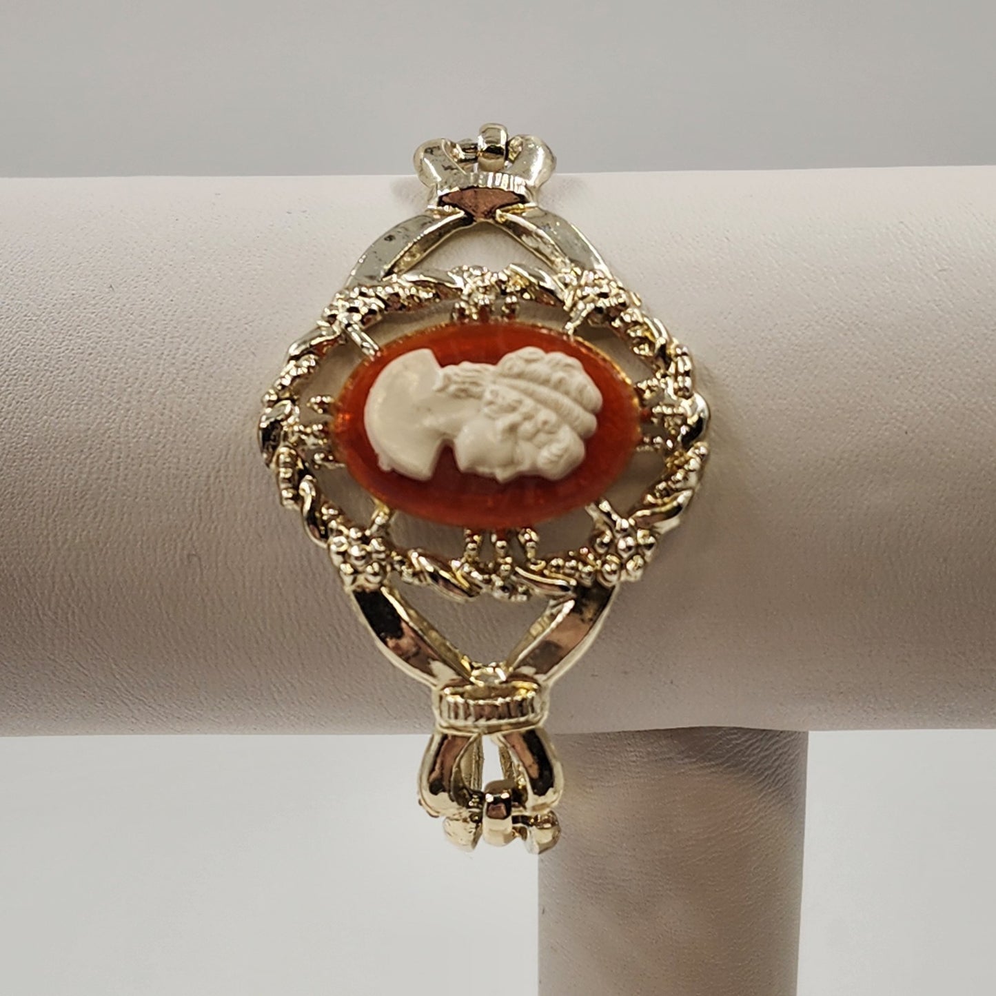 Gold Tone Hinged Bangle Bracelet with Red and White Lady Shell Cameo Charm 7"