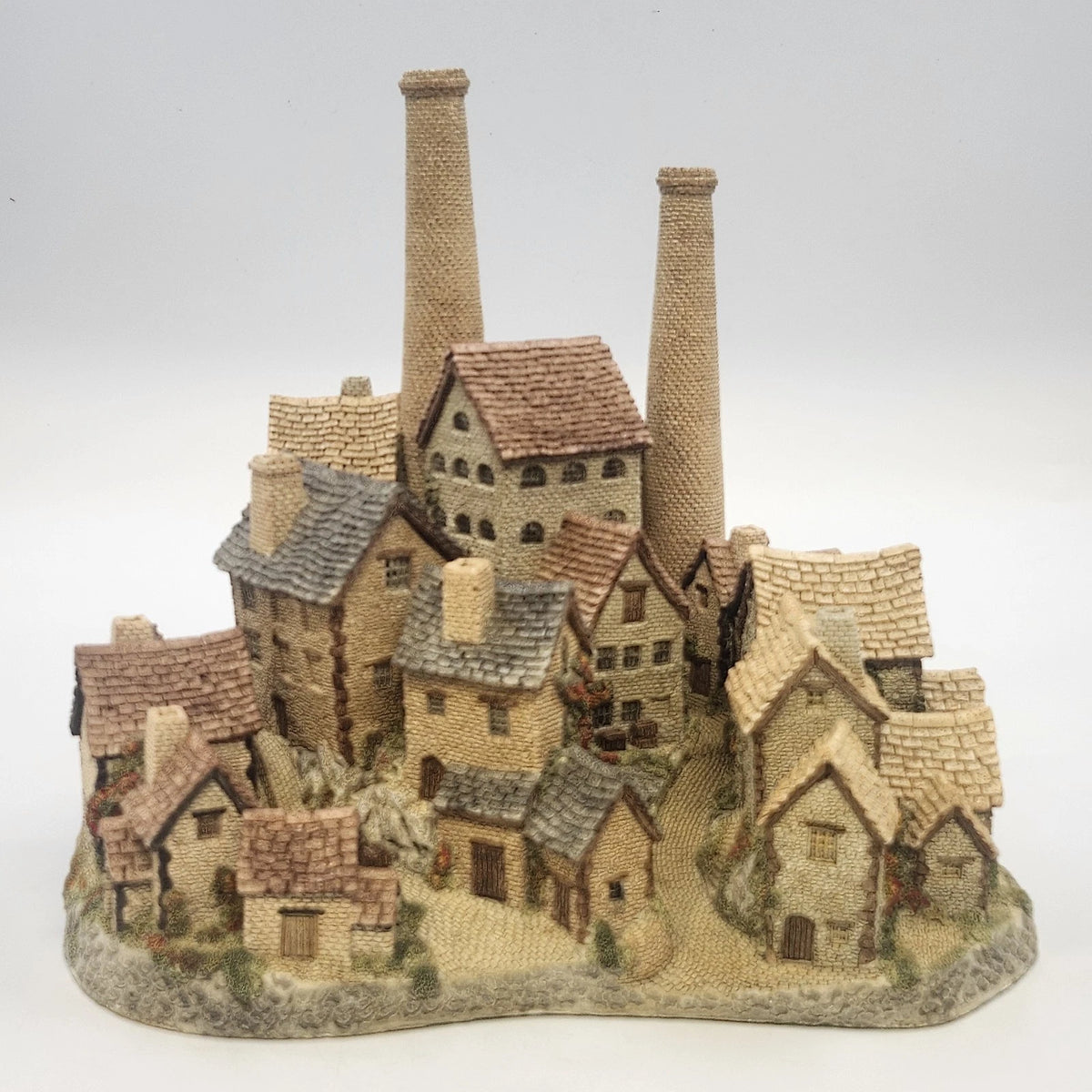 Vintage David Winter Old Distillery miniature cottage sculpture with stone buildings and chimneys