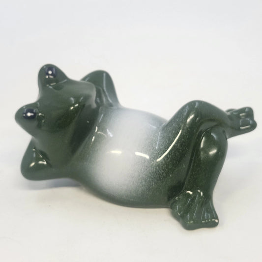4-inch glossy ceramic frog figurine in a reclining lounging pose