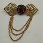 Gold Tone Filagree Metal Work & Cabochon Stone with Dangling Multi Chains Brooch
