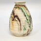 Vintage Nemadji pottery vase with green orange black and brown swirl pattern
