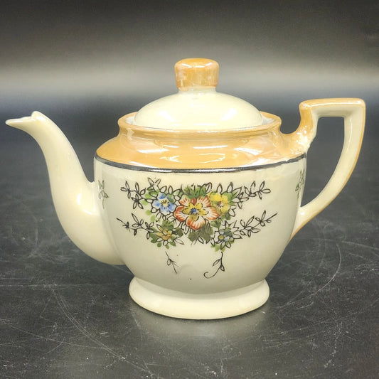 Vintage Japan porcelain teapot with hand-painted floral design and orange luster trim