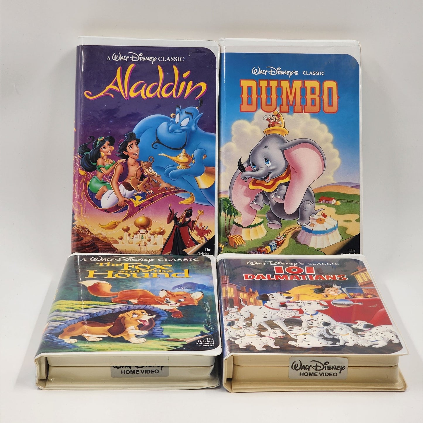 Lot Of 4 Walt Disney Classic VHS Movies ALADDIN Dumbo 101 DALMATIANS Fox & Hound