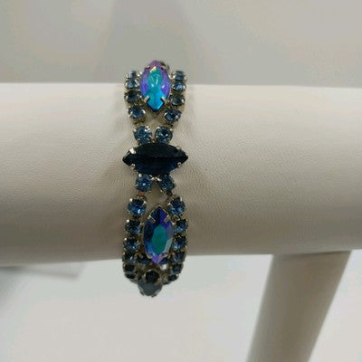 Vintage 1960s Blue Rhinestone Bracelet – Silver Tone Metal with Faceted Oval & Round Stones – Black Enamel & Leaf Detail – 7" Open Box Clasp