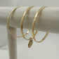 Three Set of Jewelry Bangles Thin Bracelets Gold Tone One with Gold Disc Dangle
