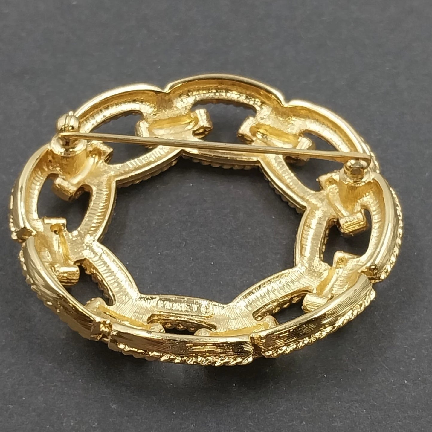 Monet Gold Tone Circle Brooch Interwoven Rope Chain Openwork Vintage