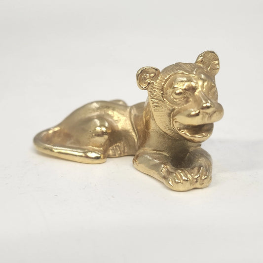Vintage 1976 MMA gold-tone reclining Egyptian lion figurine