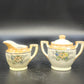 Vintage Japan porcelain creamer and covered sugar bowl with floral design and gold trim