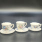 Set of three vintage Japan porcelain demitasse cups with floral saucers