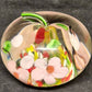 Clear Glass Apple Shaped Paperweight with Pink and Multicolor Flowers 3" Across