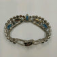 Vintage 1960s Blue Rhinestone Bracelet – Silver Tone Metal with Faceted Oval & Round Stones – Black Enamel & Leaf Detail – 7" Open Box Clasp