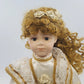 16-inch vintage porcelain Victorian lady doll in cream and gold dress
