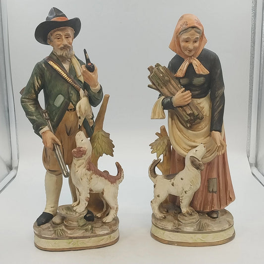 Vintage ARDCO hunter and wood gatherer figurines with spotted dogs