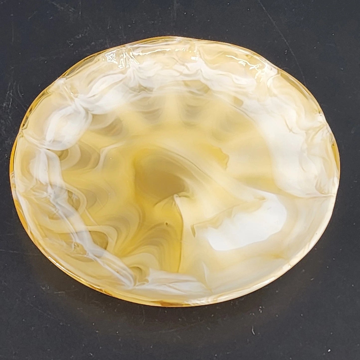 Vintage caramel slag glass plate with marbled swirl and scalloped rim