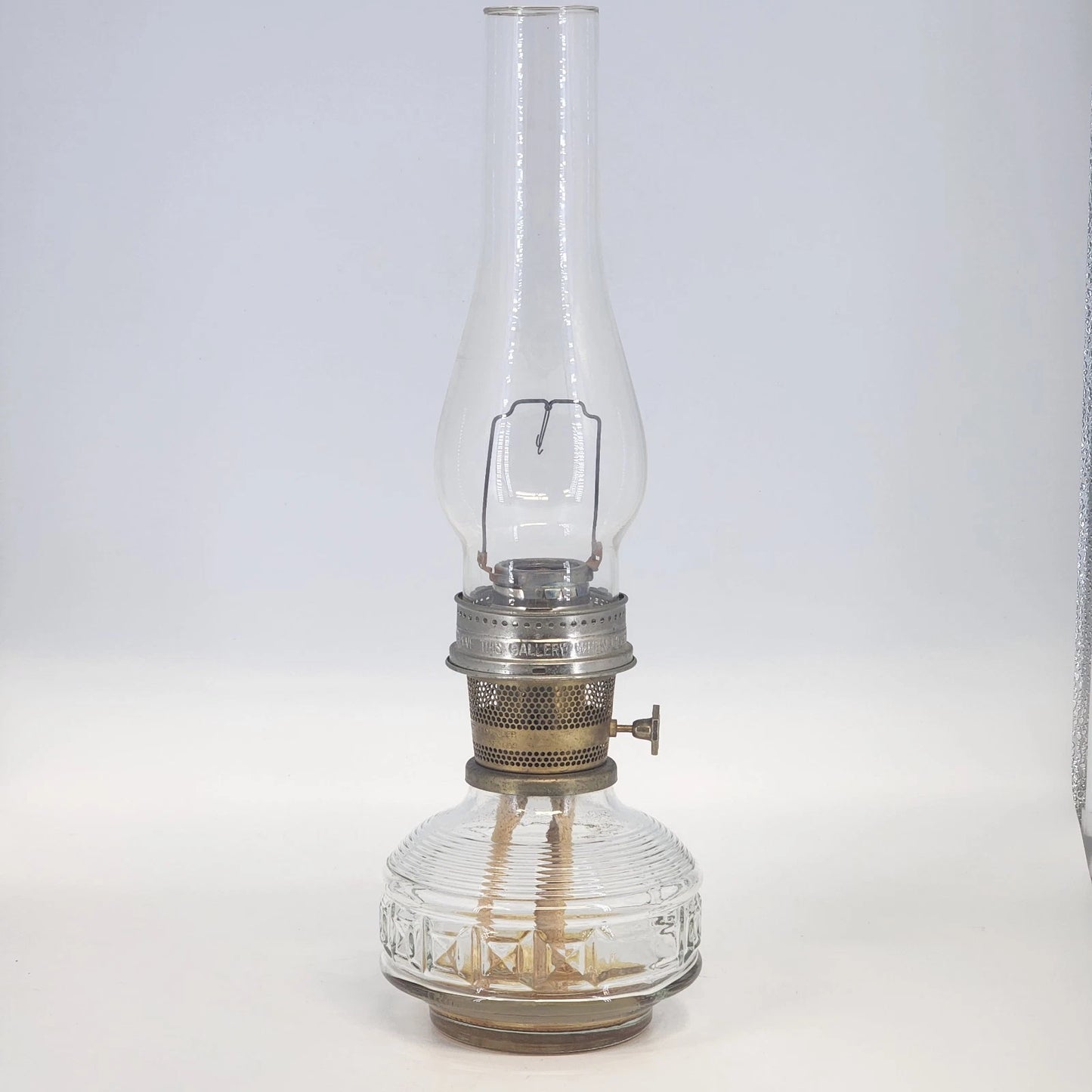 Aladdin Model 23 kerosene lamp with brass burner and clear glass base