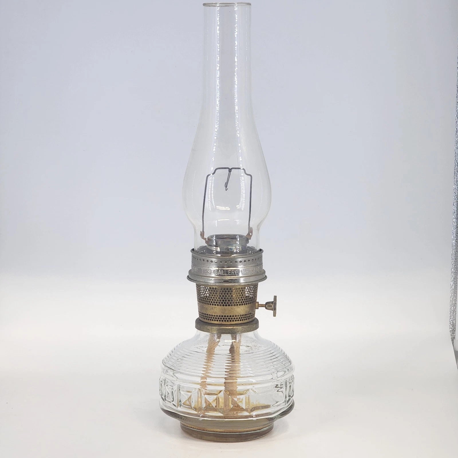 Aladdin Model 23 kerosene lamp with brass burner and clear glass base