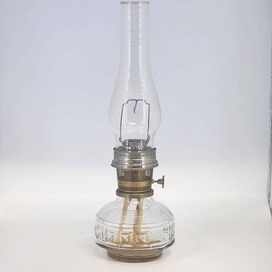 Aladdin Model 23 kerosene lamp with brass burner and clear glass base