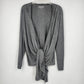 Women's gray knit cardigan with draped front and waist tie closure