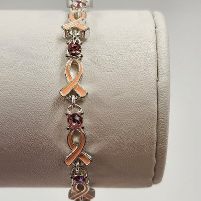 Avon pink enamel ribbon bracelet with sparkling rhinestone accents
