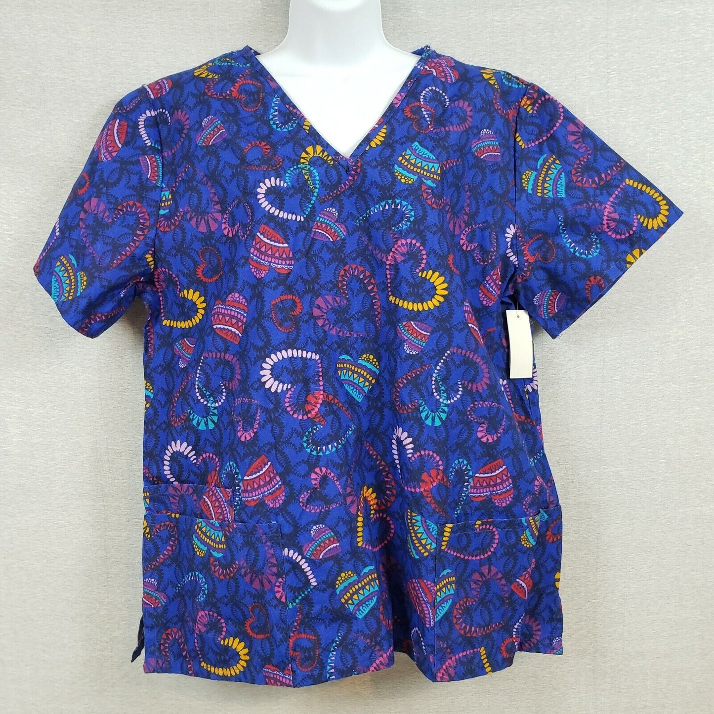 Blue patterned womens scrub top with pockets and side slits by B Scrubs