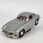 Bburago 1954 Mercedes Benz 300 SL Gullwing silver 1:24 diecast model on stand