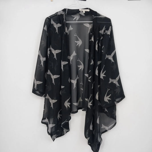Black Rainn sheer kimono cardigan with white bird print on black fabric