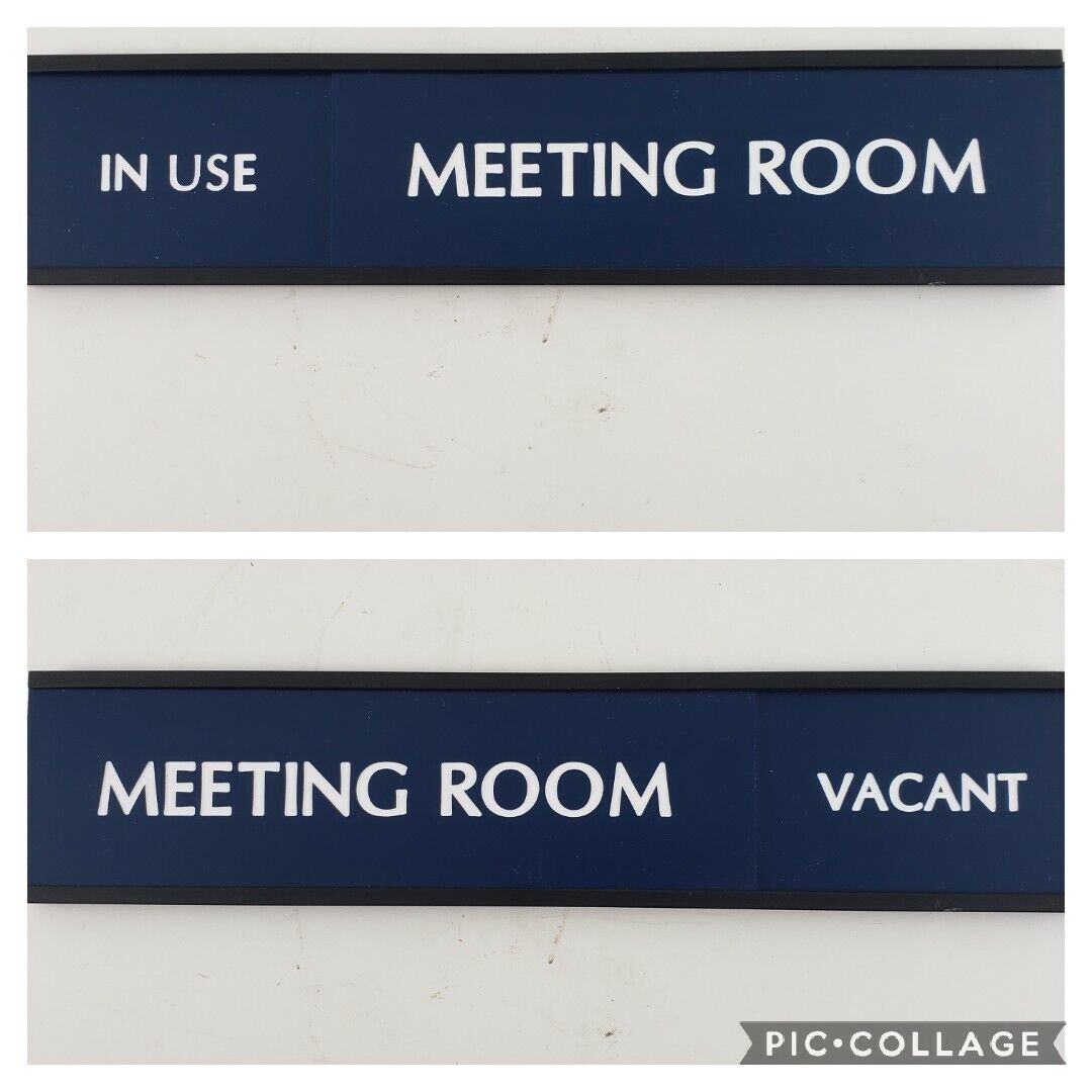 Blue sliding meeting room sign in use vacant