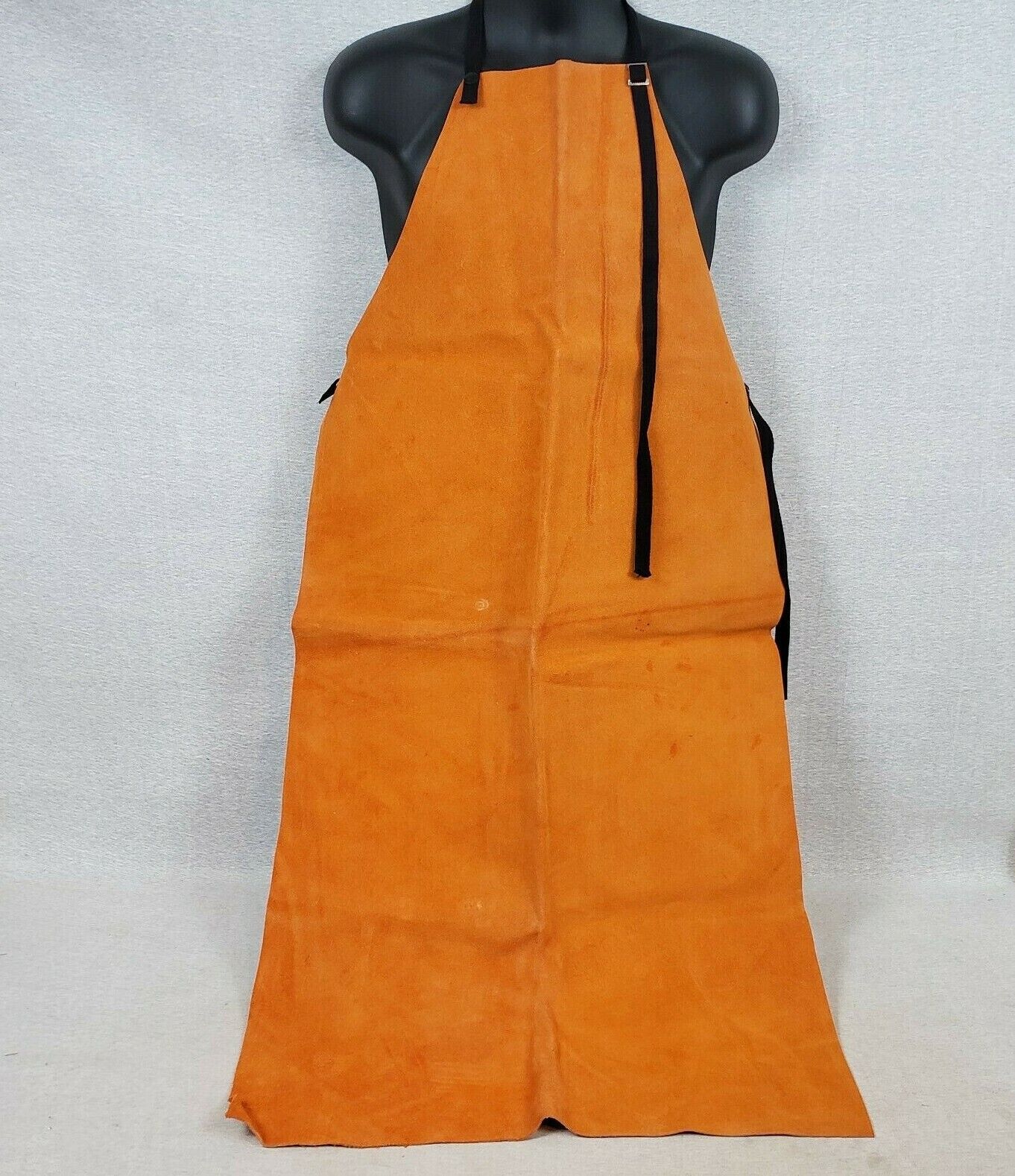 Rust split leather welding bib apron with adjustable straps and snap closure
