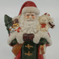 Ceramic Santa figurine with Christmas tree and teddy bear