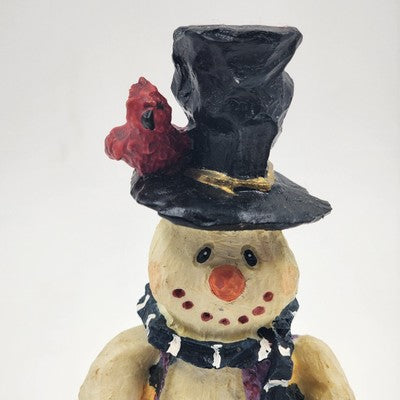 Ceramic snowman figurine with cardinal bird and black top hat